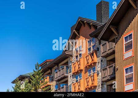 Apartment condo condominium building lodge in small ski resort town village of Snowshoe, West Virginia looking up low angle view Stock Photo