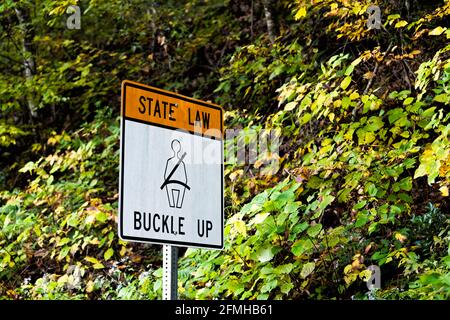 Virginia state law buckle up sign for car seat belt text sign on road in mountain Highland county, VA Stock Photo