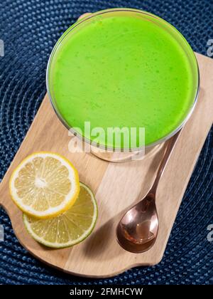 Lemon mousse in glass bowl with lemon gelatin on top. Stock Photo
