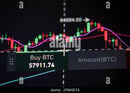 Shallow depth of field footage with details of Bitcoin cryptocurrency price fluctuations on a crypto exchange app, on a digital screen. Stock Photo