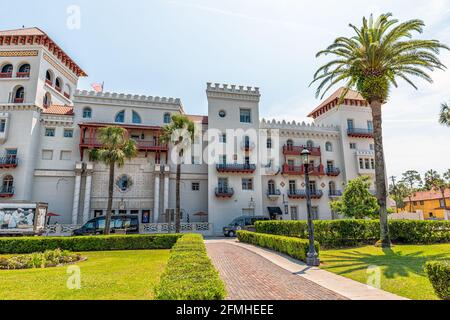 St. Augustine, USA - May 10, 2018: Casa Monica resort and spa building exterior on sunny day in historic city and palm tree Stock Photo