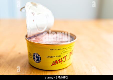 Herndon, USA - December 17, 2020: Storebought traditional canned cod liver in oil in can with open lid wild caught in Iceland as illustrative editoria Stock Photo