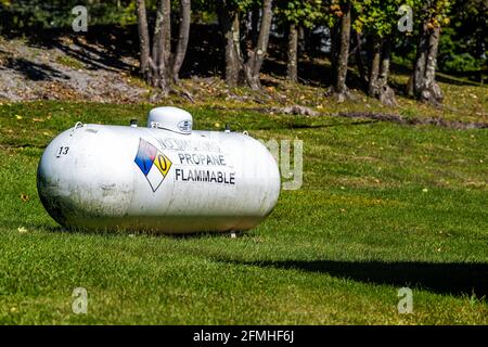 Cass, USA - October 6, 2020: Sign for Southern States propane butane energy residential storage tank with danger warning for flammable fuel in West Vi Stock Photo