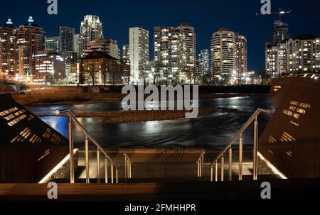 Calgary Alberta Canada, May 01 2021: Waterfront public gathering area along the Bow River and Memorial Drive in downtown Calgary at night. Stock Photo