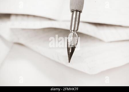 Old vintage fountain pen on a papers background Stock Photo
