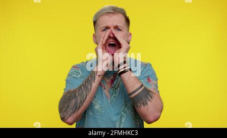 Man scream with hand near mouth waving and greeting with hand as notices someone shouting hello