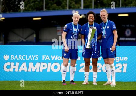 Chelsea's Bethany England, Jess Carter and Sophie Ingle celebrate with the FA Women's Super League Trophy during the FA Women's Super League match at Kingsmeadow, London. Picture date: Sunday May 9, 2021. Stock Photo