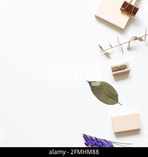 Office desk. Memo pad, clip, pencil sharpener, eraser on white background. top view, copy space Stock Photo