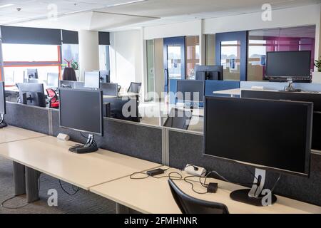 Sydney office building interior with empty desks and offices due to covid 19 virus pandemic requiring people and staff to work from home,Sydney Stock Photo