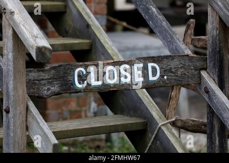 A closed sign on a set of stairs at the Weald & Downland Living Museum in Singleton, Chichester, West Sussex, UK. Stock Photo