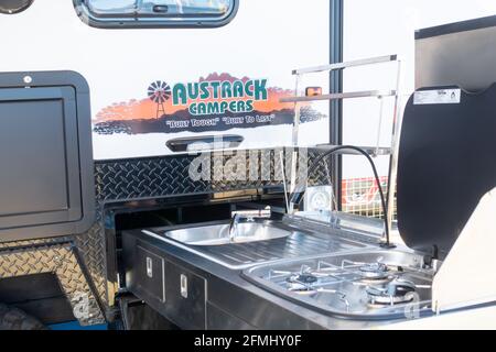 Kitchen slides out of small camper van. Stock Photo