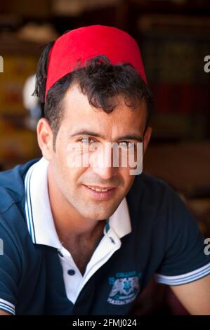 Young Turkish man wearing a fez Stock Photo