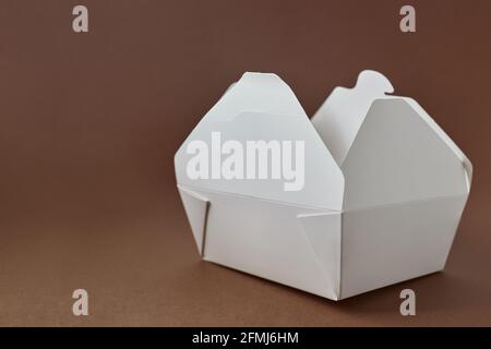 White paper food container on brown background Stock Photo