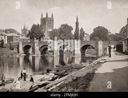 A late 19th Century view of the River Wye as it flows through Hereford, a cathedral city and the county town of Herefordshire, England. In the foreground is the Wye Bridge, contructed in the late 15th century with  Hereford Cathedral dating from 1079 behind. The cathedral contains the Mappa Mundi, a medieval map of the world dating from the 13th century.