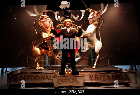 PY GERBEAU DOME CHIEF EXECUTIVE IN FRONT OF A GERALD SCARFE SCULPTURE OF AN ALTERNATIVE BRITISH CREST, INCORPERATING THE QUEEN AND TONY BLAIR. GERBEAU WAS LAUNCHING THE NEW SUMMER ADVERTISING CAMPAIGN, 'YOU'VE GOT A MIND OF YOUR OWN, USE IT AT THE DOME. Stock Photo