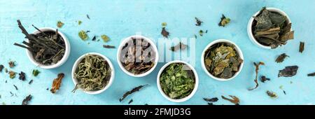 Sea vegetables panorama, top shot on a blue background. Many different edible types of seaweed Stock Photo