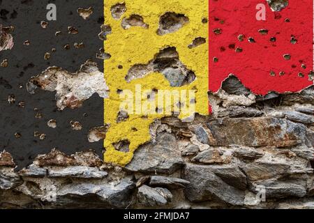 Concept of the Political Situation in Belgium a damaged painted flag on a cracked wall with wholes. 3D-Illustration. 3D-rendering Stock Photo