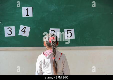 This rural school was destroyed during the 2008 Sichuan earthquake. Sutdent learning English and must choose the correct number. Stock Photo