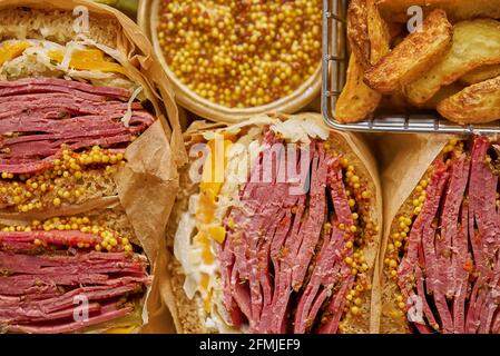 Reuben sandwich. Classic traditional American sandwich. Pastrami and corned beef on grilled bread Stock Photo