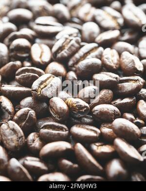 Close up picture of dark roasted coffee beans, selective focus. Stock Photo