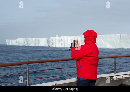 Antarctica, Southern Ocean. Tabular Iceberg, C28B (location 60° 51' 03' S 51° 33' 00' W) as seen from the deck of expedition cruise ship. Editorial on Stock Photo