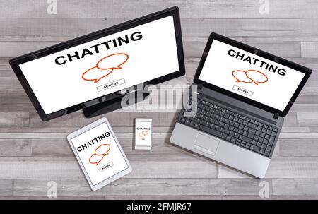 Chatting concept shown on different information technology devices Stock Photo