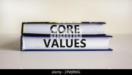 Core values symbol. Books with words 'core values' on beautiful wooden table. White background. Business and core values concept. Copy space. Stock Photo