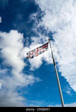 Photograph of the Union Jack British flag flying on a flagpole against ...