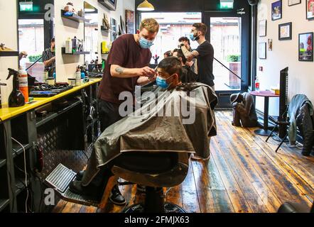 Barbers at the Neighbourhood Threat barber shop in Dublin City