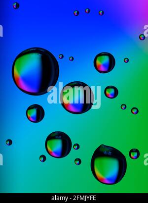 Beautiful Coloured Diffraction Effects From Water Droplets On Glass Against A Multicoloured Background Stock Photo Alamy