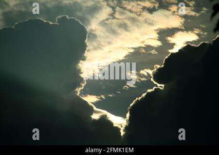 Dark large clouds covering the sun Stock Photo