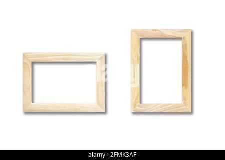 Two wooden picture frames hanging on a white wall. Blank mockup template Stock Photo