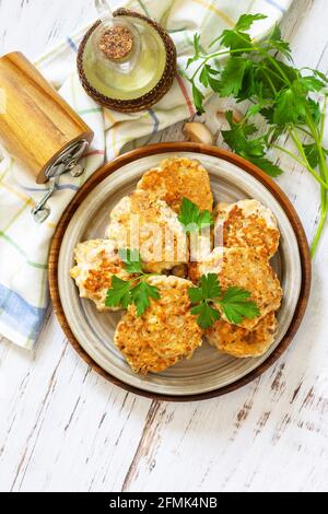 Healthy vegan food. Tasty homemade Red fish cutlets on a wooden rustic table. Top view, flat lay background. Copy space. Stock Photo