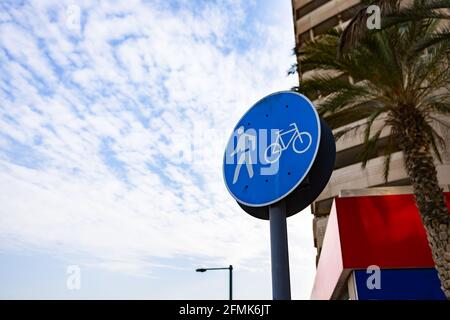 Bicycle and pedestrian shared route sign in Dubai Stock Photo
