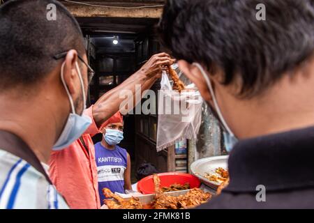 Traditional chicken-fried selling motion  on the street in the month of Ramadan 2021, I Captured this image from Chak Bazar, Dhaka, Bangladesh, Asia Stock Photo