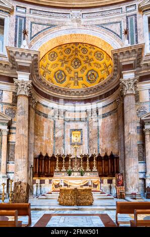 View of religious altar under decorated dome inside catholic cathedral in Rome Stock Photo