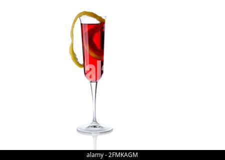 Red cocktail with lemon zest in trumpet glass isolated on white, copy space Stock Photo