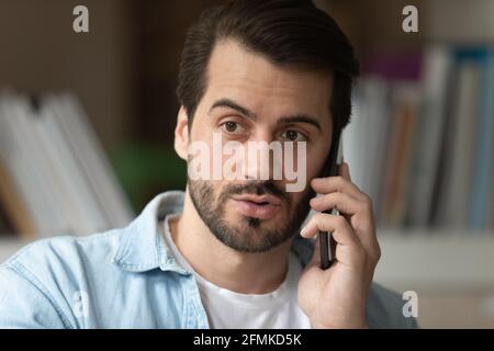 Head shot confident man talking on smartphone, making phone call Stock Photo