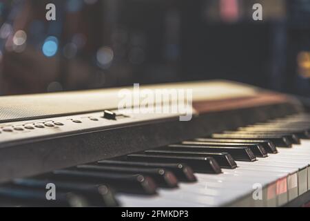 Close up of synthesizer keys on a blurred background. Stock Photo