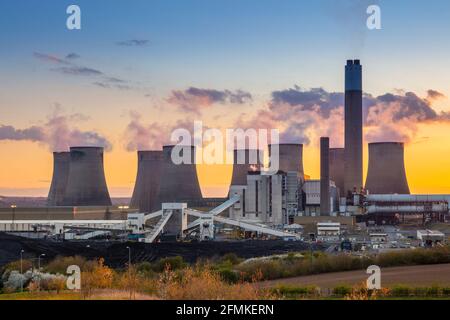 Ratcliffe-on-Soar coal power station with steam from the cooling towers at sunset Ratcliffe on soar Nottinghamshire England UK GB Europe Stock Photo