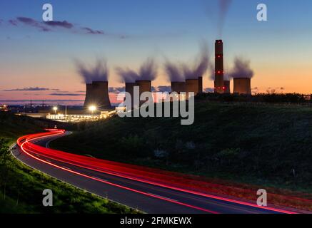 Ratcliffe-on-Soar coal-fired power station with steam from the cooling towers at night with light trails Ratcliffe on soar Nottinghamshire England Uk