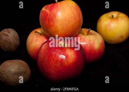 Red apple on a black background. Fruits are full of vitamins Stock Photo