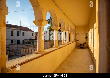 Buildings in Milna on Brac island, street without tourists, Dalmatia in Croatia Stock Photo