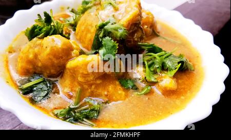 Homemade kashmiri dum aloo: spicy potato closeup on the pan on the table Stock Photo