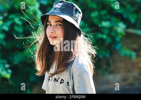 Fresh summer girl in t-shirt and bucket hat. Stock Photo