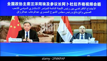Beijing, China. 10th May, 2021. Wang Yang, chairman of the National Committee of the Chinese People's Political Consultative Conference, meets with Egyptian Senate Speaker Abdel Razeq, via video link in Beijing, capital of China, May 10, 2021. Credit: Yin Bogu/Xinhua/Alamy Live News Stock Photo