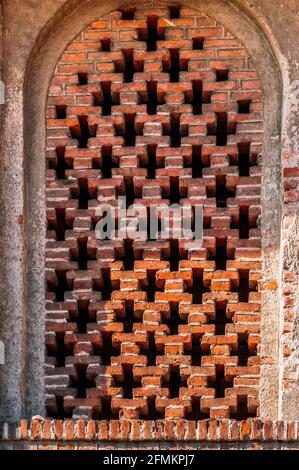 window arch in the old brick wall Stock Photo
