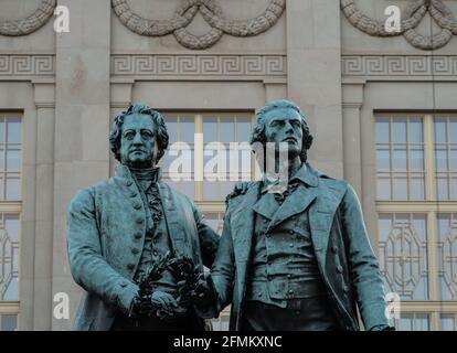 Closeup view of sculpture monument statue of Johann Wolfgang Goethe and Friedrich Schiller in front of German National Theatre in Weimar Thuringia Ger Stock Photo