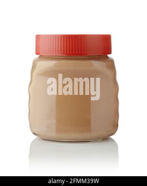 Organic nut paste in a closed glass jar isolated on white. Stock Photo