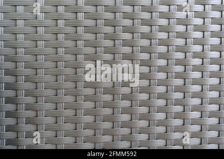 Synthetic grey rattan close up. Gray background texture Stock Photo